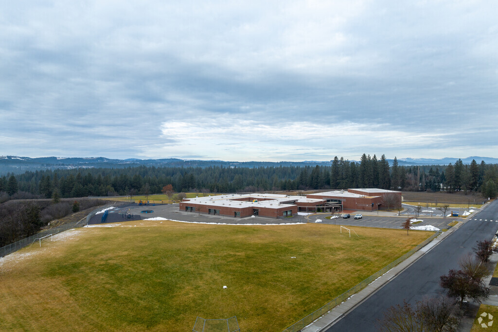 Meadow Ridge Elementary features a large outdoor area next to the school.