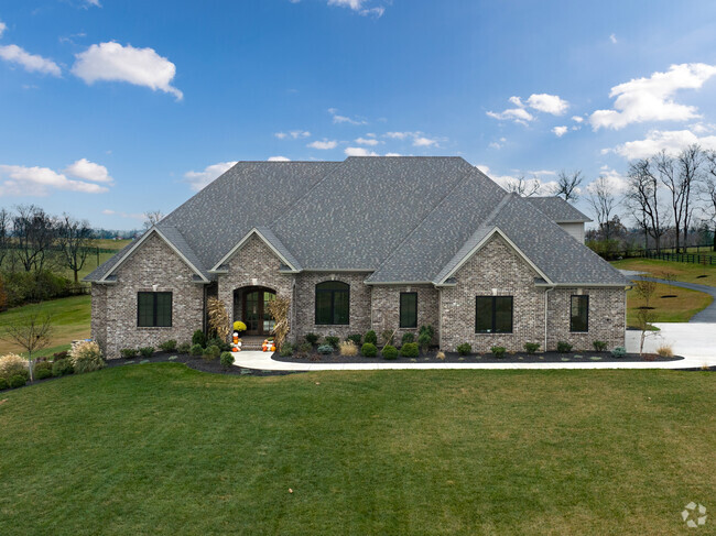 A brick ranch home sits on a spacious rural lot in Southeast Scott County.