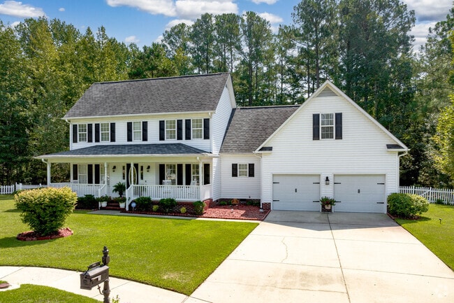 There are Colonial homes with extra bedrooms in South View, NC, and a garage attached.