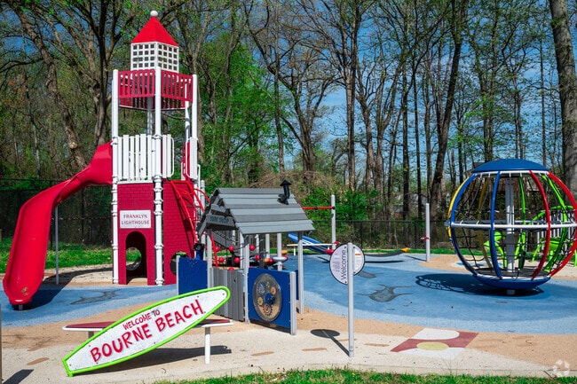 A beach-themed playground sits beside J. Franklyn Bourne Pool in Peppermill Village.