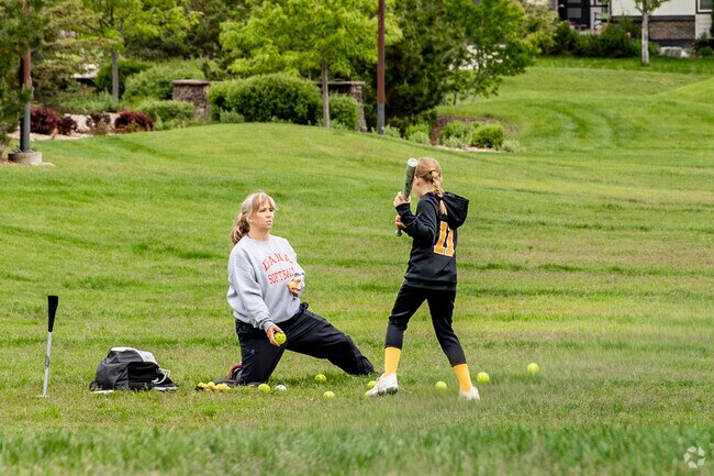 Children growing up in Stepping Stone have access to playgrounds, splash pads, and grassy fields that encourage outdoor fun and imaginative play, like here at Winding Path Park.