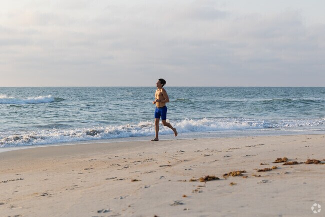 Locals start the day with a sunrise jog along Litchfield Beach’s scenic shoreline.