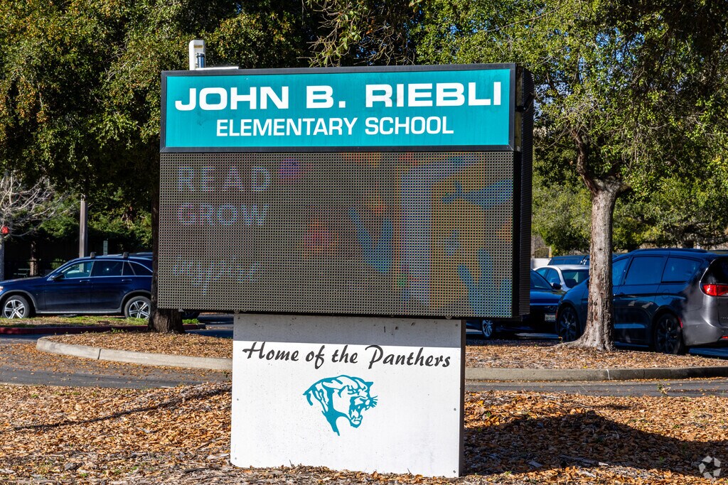 John B. Riebli Elementary School serves grades K-6 with a student-teacher ratio of 19 to 1.