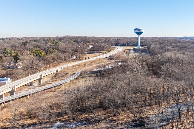 A pedestrian bridge on Red Gate Road connects joggers and cyclists to the Fox River Trail.