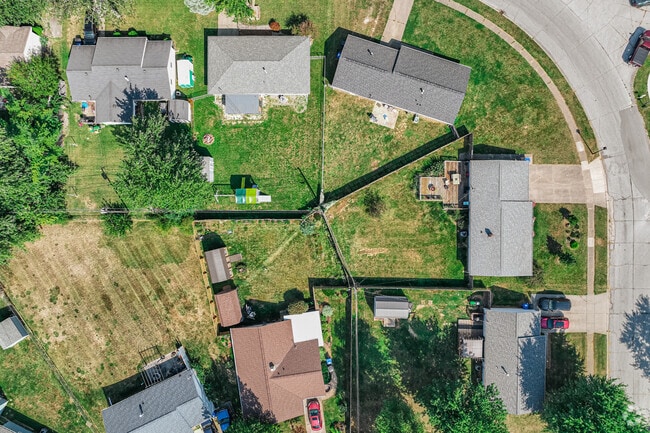 A bend in the road, in Orleans Southwest, brings neighboring yards together like pie slices.