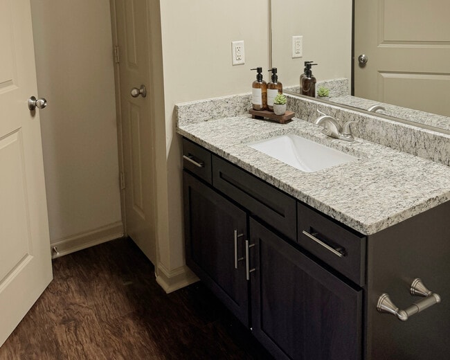 Modern Bathroom with Espresso Cabinets and Granite Countertops