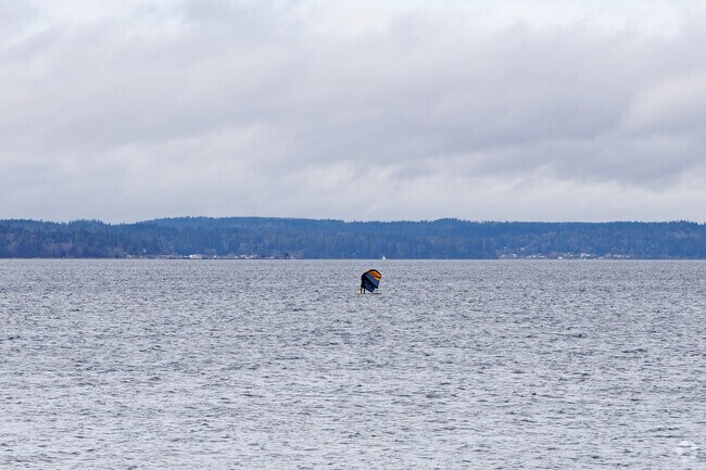 Windsurfers can enjoy the accessibility that Golden Gardens Park can offer to the Puget Sound.