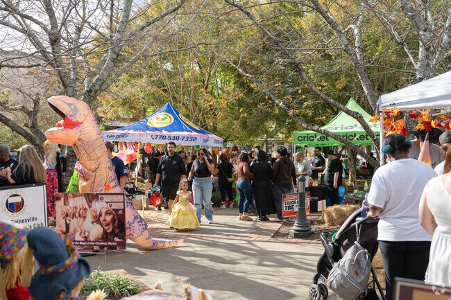 A lively Halloween atmosphere fills the Central Core at Gainesville’s trick-or-treat event.