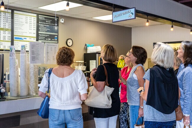 Central Park residents head to grab a cup of coffee and converse at World Cup.