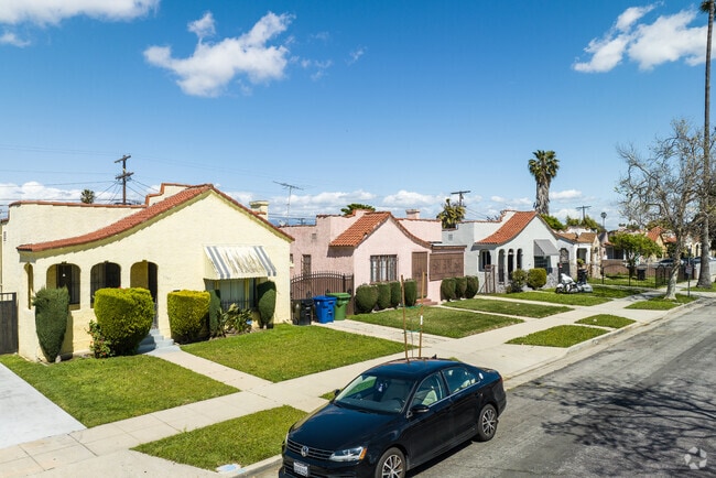 A row of pastel-colored homes with well-manicured lawns in Chesterfield Square.