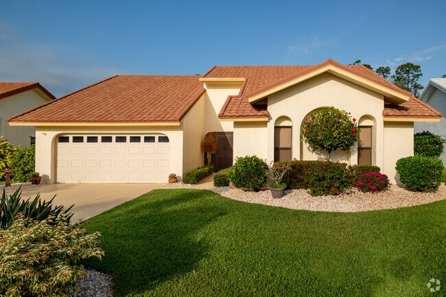 Many Cross Creek ranch homes include garages and Spanish-inspired design features.