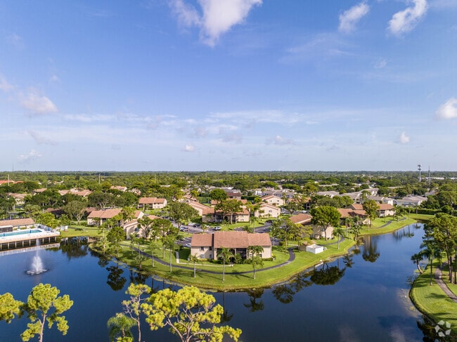 The Ashley subdivision is characterized by lush greenery and clear blue bodies of water.