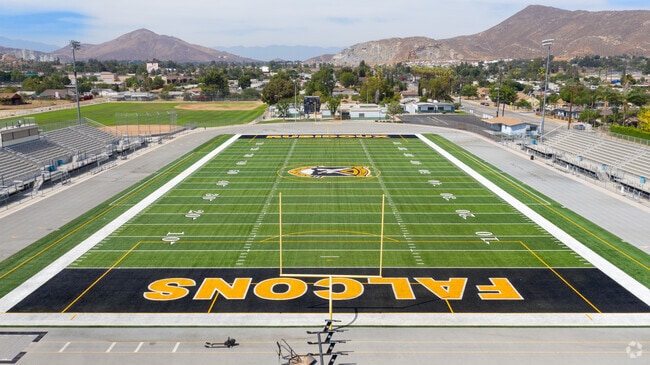 Well-maintained football field draws in the community to watch the Rubidoux High School team.