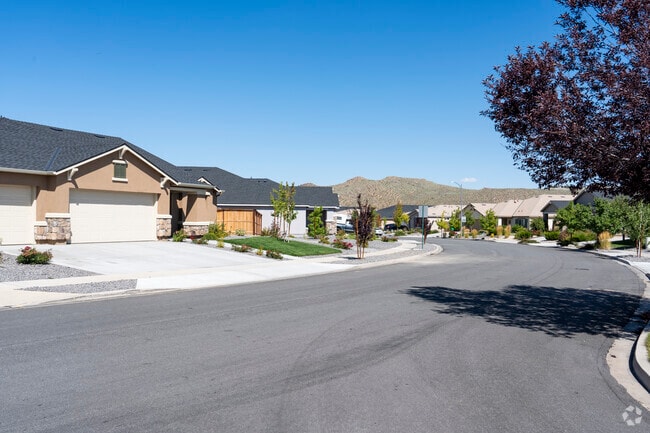This Golden Valley community is bound to an HOA resulting in the tidy front yards.