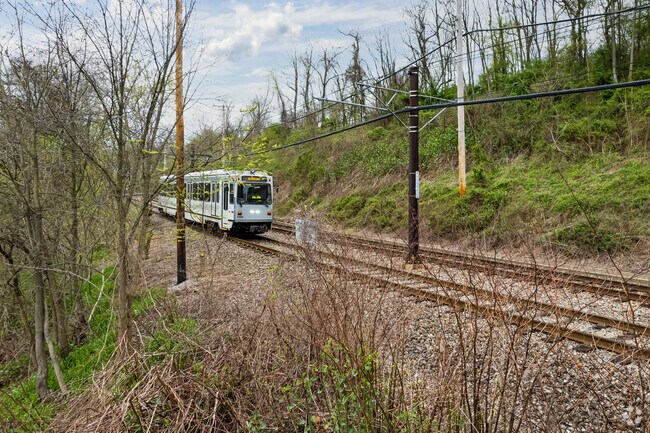 The train tracks pass through Overbrook to take passengers to Pittsburgh.