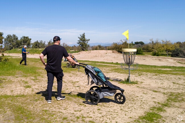Northeast Fresno residents stop by Woodward Park for a game of disc golf.