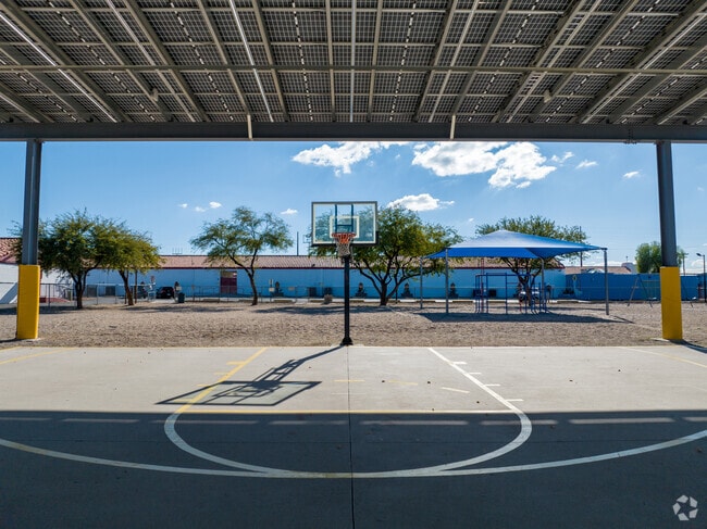 Students love playing basketball on the covered courts at St. John the Evangelist