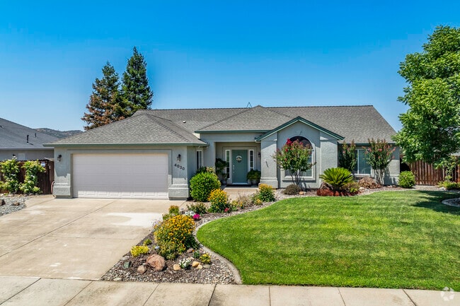 This newer post 2000 built home has stucco siding and beautiful landscaping in Country Heights.