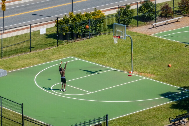 Public basketball courts are active during the afternoons at Miller Park.