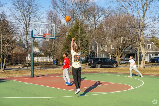 Practice your jump shot on the basketball courts in Maple Dawson Park.