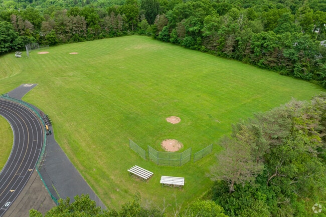 Newfield Senior High School features a large wide open green space for student activities.