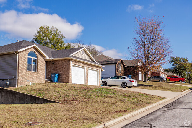 Duplexes sit side by side along the crest of a hill in Forest Ridge.