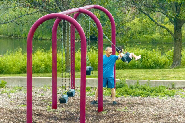 Residents enjoy the playground at nearby Wildflower Park.