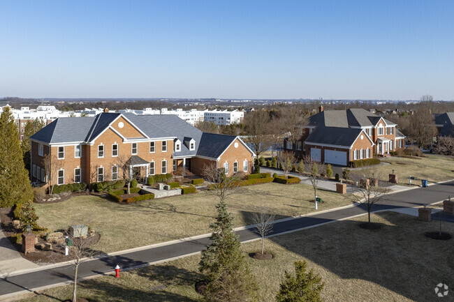 Large new traditional homes in the gated neighborhood of Belmont give families a safe place to call home.
