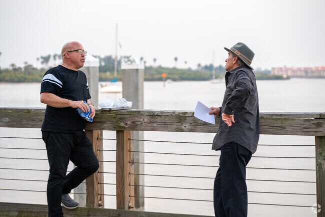 Southwest New Smyrna locals stop for a chat along the inlet on Canal Street.