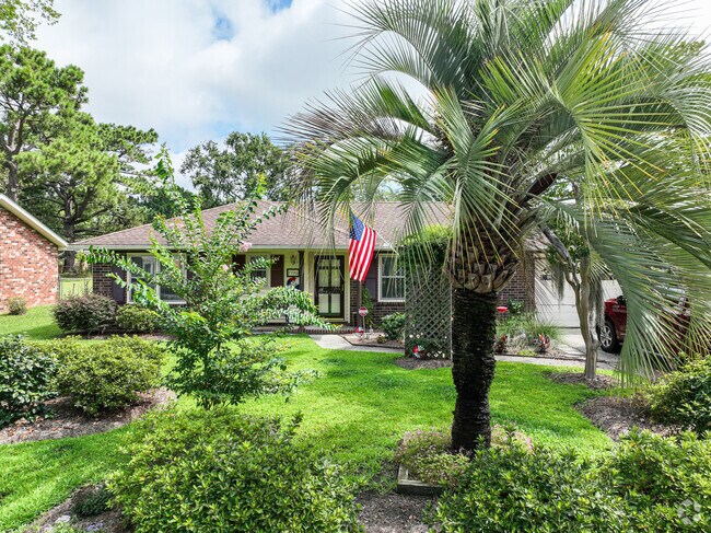 Forest Hills homes have mature landscaping and green front lawns.