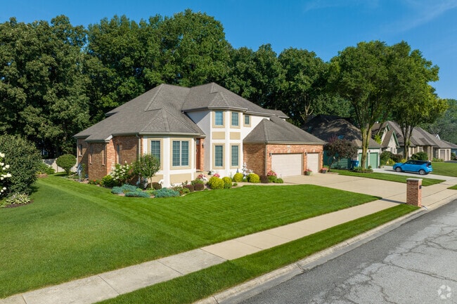 Homes in Schererville sit on well-maintained lawns.