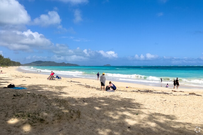 Locals stroll along Waimānalo Beach for serene coastal views.