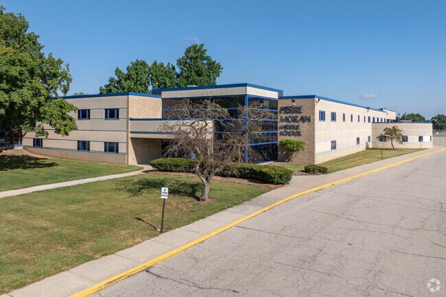 A pickup drive can be found on the western edge of Pierre Moran Middle School's parking lot.