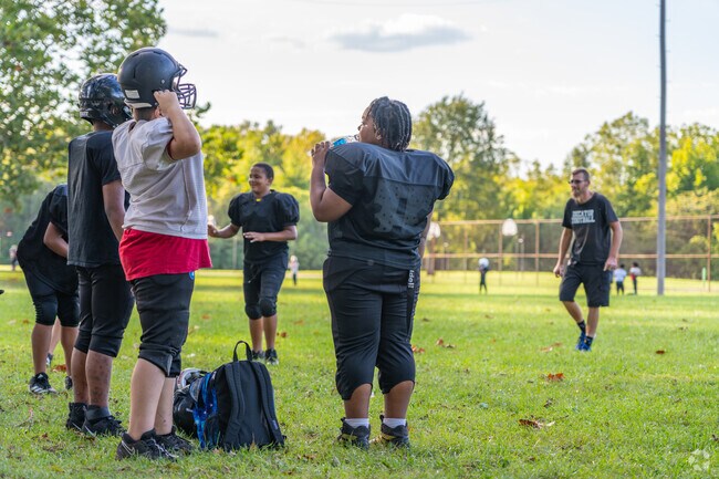 Young football players discuss gameplay at Garman Park, located near Fairlawn.