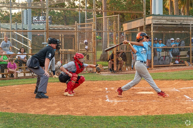 Whispering Pines Park has a baseball field and many other sports courts near Crane Landing.