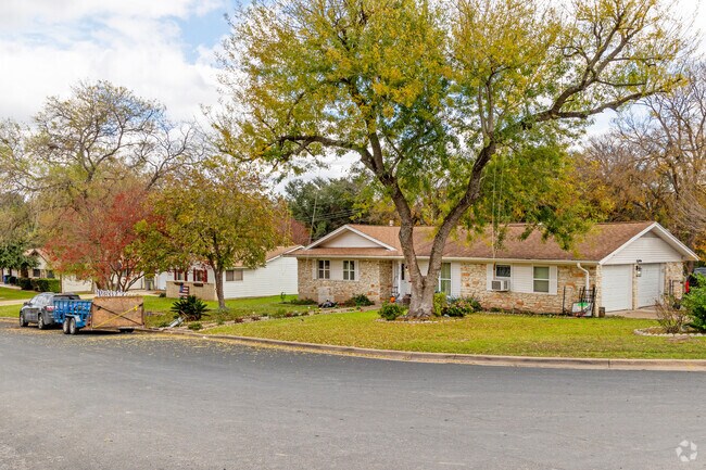 Homes in Del Valle tend to have large, lush yards with mature oaks.