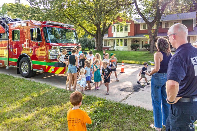 The neighborhood kids gathered for a photo in front of the fire truck at National Night Out.