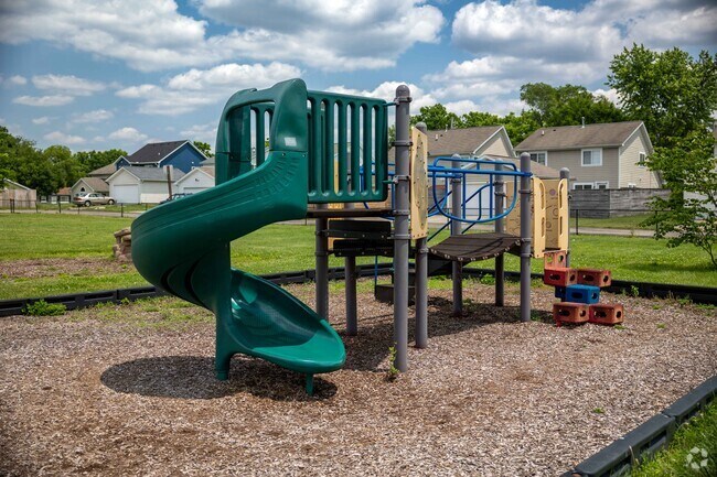 Maple Park has a small playground for kids to enjoy.
