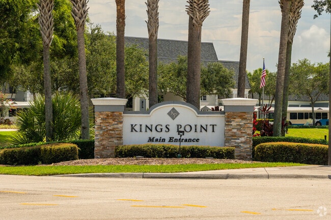 Kings Point sign at entrance of gated community.