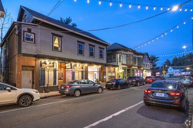 The vibrant Pascoag Main Street pulses with energy, adorned by bustling shops and local cafes.
