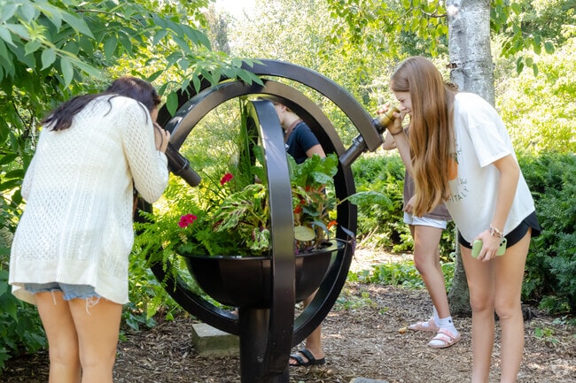 Visitors enjoy the unique views of Garden Kaleidoscope in The Paine Art Center & Gardens.