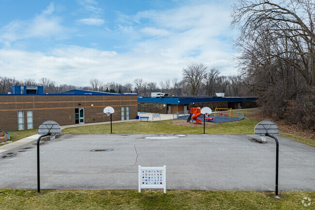 Gudith Elementary School features basketball courts for students.