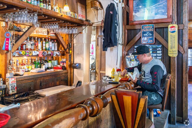 A man enjoys his sandwich and fries at The Rock Inn in nearby Lake Hughes.
