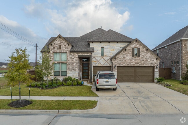 A two story home with a three car garage in Webster, Texas.