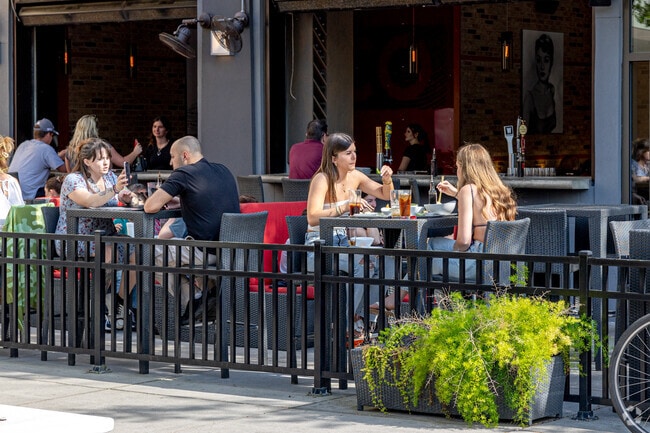 Customers of Co Sushi at the Market Common enjoy sushi near Seagate Village.