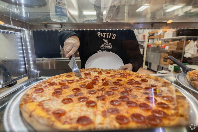 Residents enjoy pizza by the slice at Patti's la Cucina in White Oak.