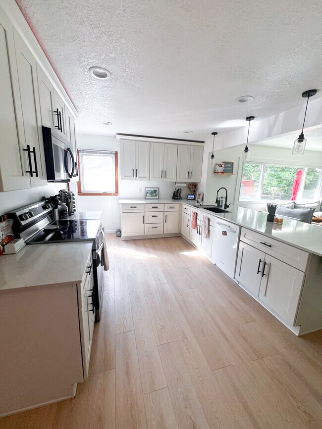 View of kitchen facings south (plenty of light)
