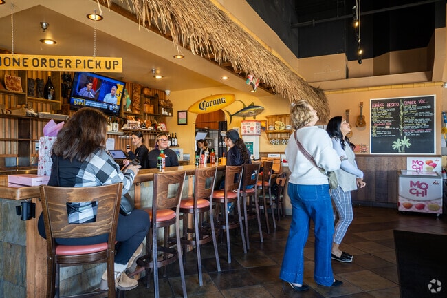 These people are checking the tasty Japanese menu at Teri's Cafe in Mira Costa.
