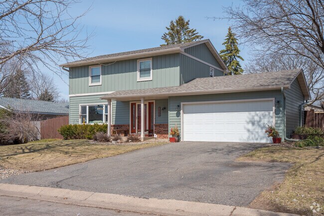 A sage colored contemporary home in the Battle Creek neighborhood.