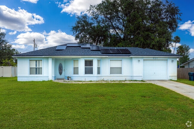 Solar panels and a light-blue accent highlight a home in Neighborhood K.